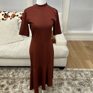 Brand new mock neck dress with ruffle asymmetrical hem!